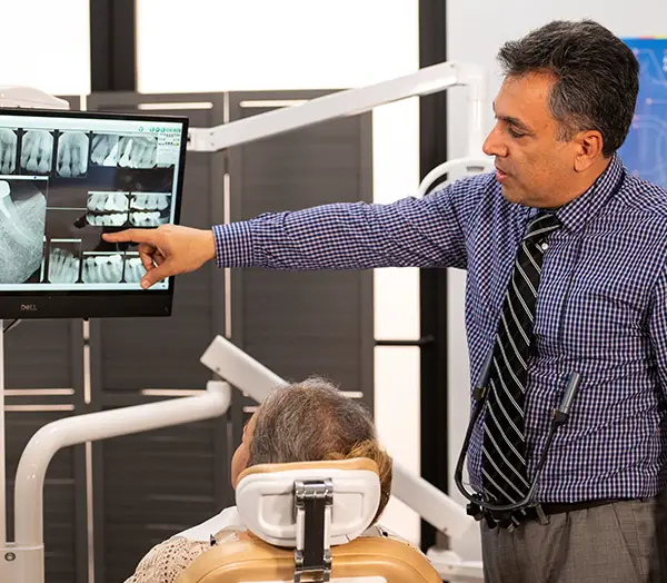 Image Gallery | Dr. Allen showing a patient their x-rays
