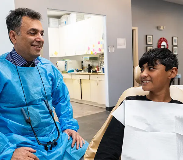 Image Gallery | Dr. Allen speaking to a patient